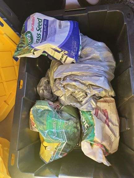 Totes, one with grass seed image