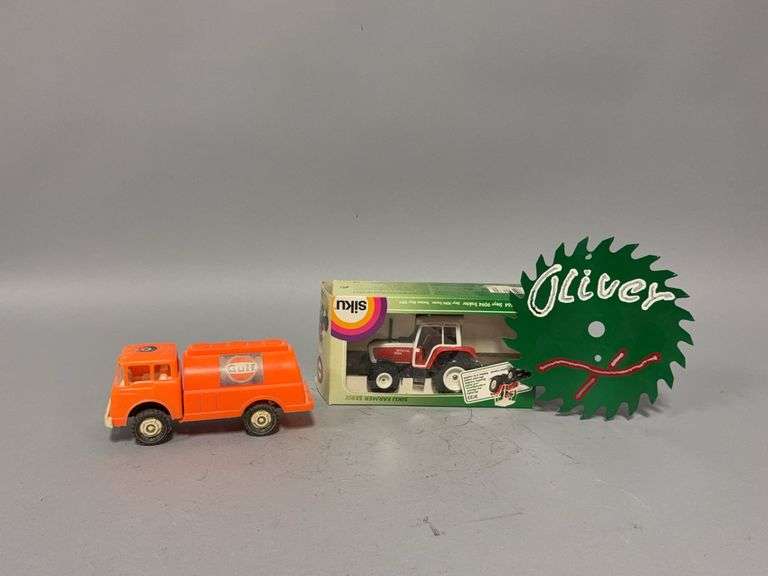 Gay Toys Gulf gas hauler, hand painted “Oliver” circular saw blade and 1:32 siku Steyr 9094 tractor image