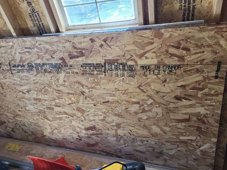 Two 4x8 sheets of oriented strand board (OSB) image