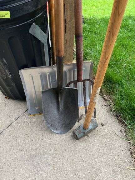 Snow shovel, round point, maul, potato fork and large garbage can w/ lid