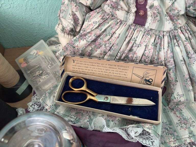 Cloth rabbit with a box of sewing notions