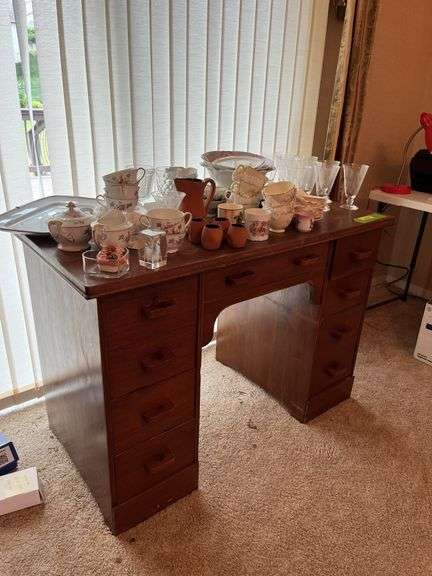 Small knee hole desk and assorted stemware, dishes etc...