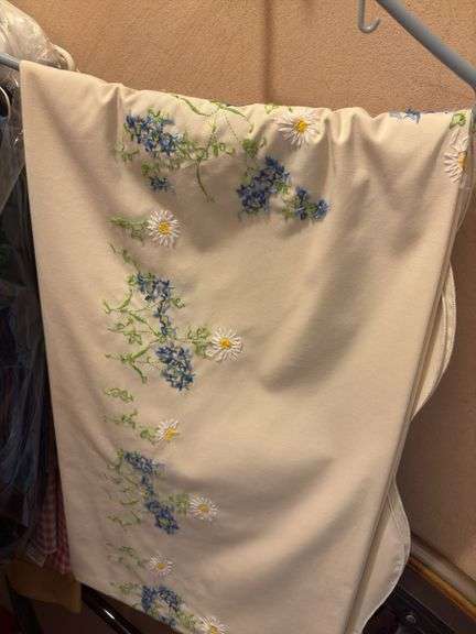 9 hangers of table linens