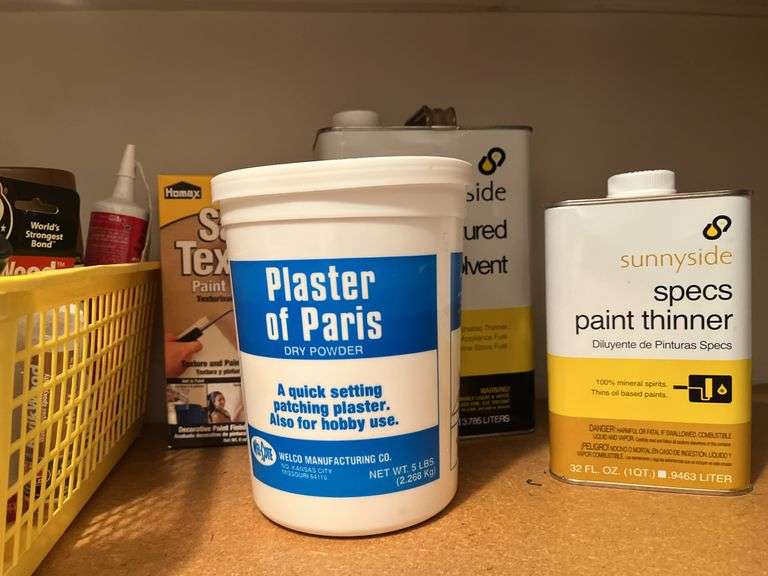 Shelf with painting supplies and other household items