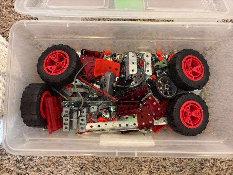 Basket of large tinker toys and Erector set pieces