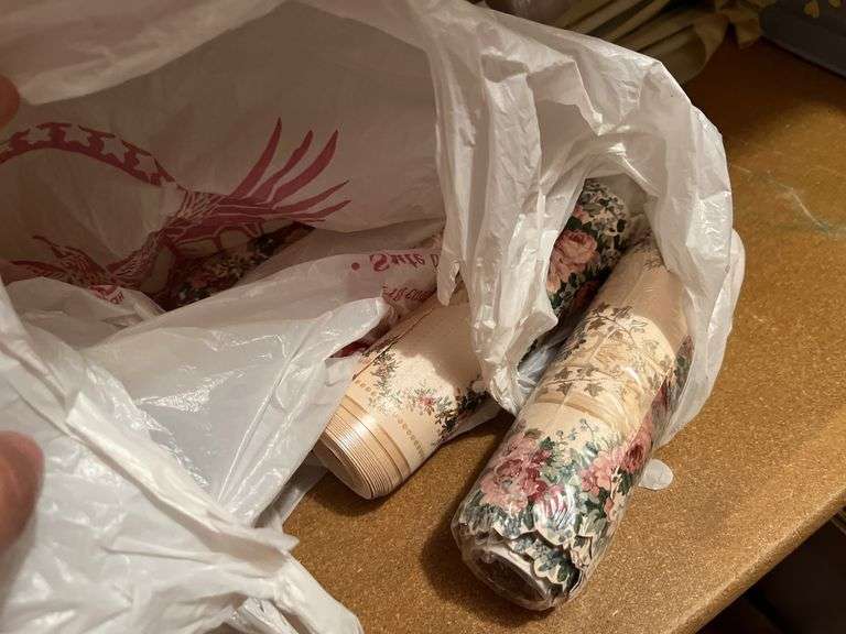 New curtain rods and box of wallpaper, some new