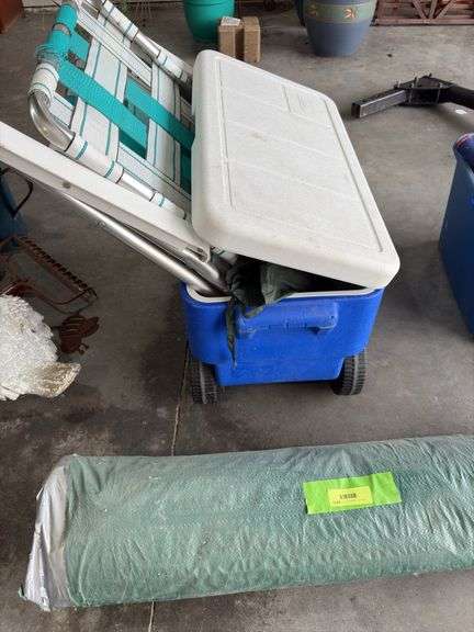 Coleman rolling cooler, lawn chair and a canopy so you can sit in the shade while you drink alone.