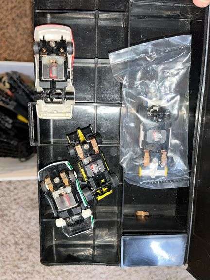 12D x 12L x 72H shelf unit w/ VHS movies, RC car, slot car track and 3 slot cars