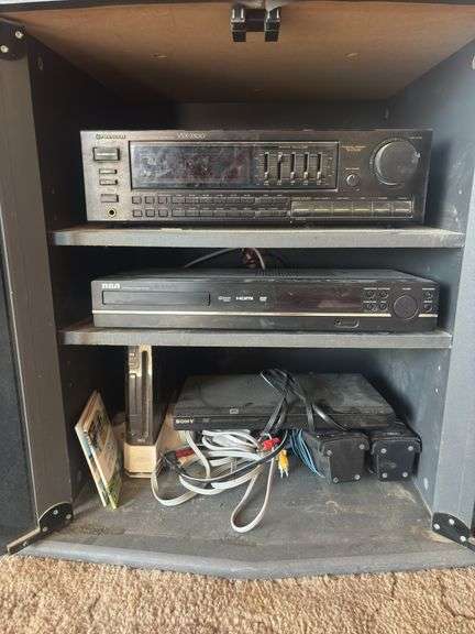 Entertainment center - with DVD player RCA DVD home theater system, pioneer stereo, and Wii gaming system