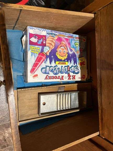 Contents of wardrobe includes 4th of July decor and many vintage kitchen utensils