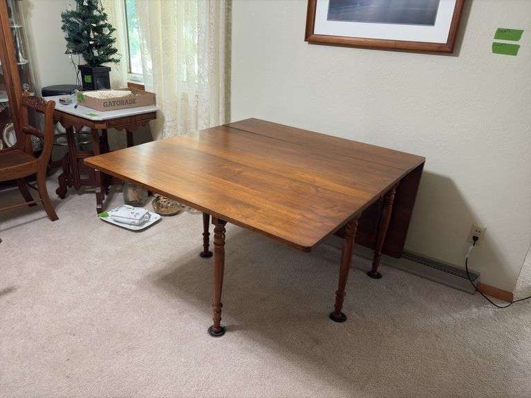 Kraus Furniture Amana walnut gate leg drop leaf dining table 45 x 60 with (3) 12" leaves, table pads, turned legs.
