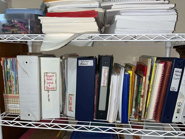 White metal shelf unit full of education materials BRING YOUR BOXES