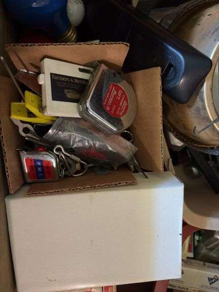 Typical junk drawer items, hand tools, key chains, book matches, etc