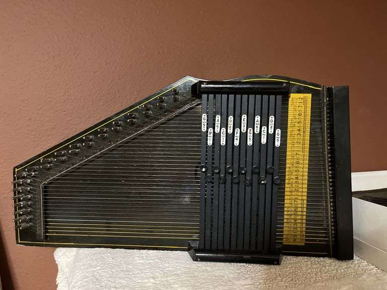 2 stringed musical instruments, Apollo Harp and another similar one