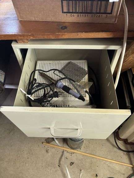 Desk, file cabinet and drawer full of stained glass making items