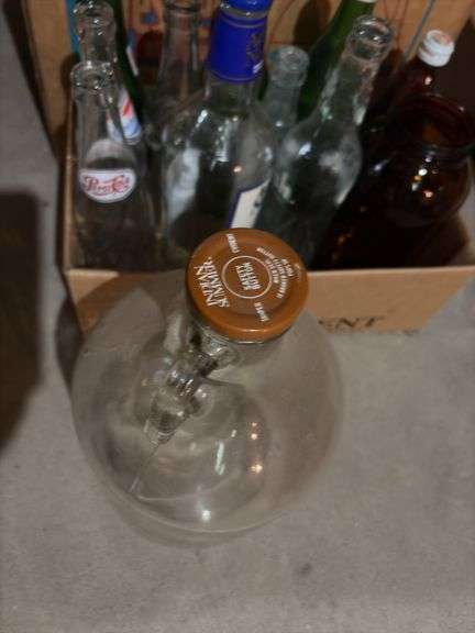 Various glass bottles and jars includes blue glass, Coca-Cola 1 gallon bottle, old soda bottles, etc