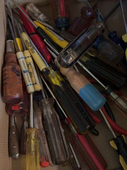 Typical junk drawer items, hand tools, key chains, book matches, etc
