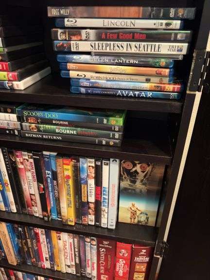 160+ DVDs and storage cabinet