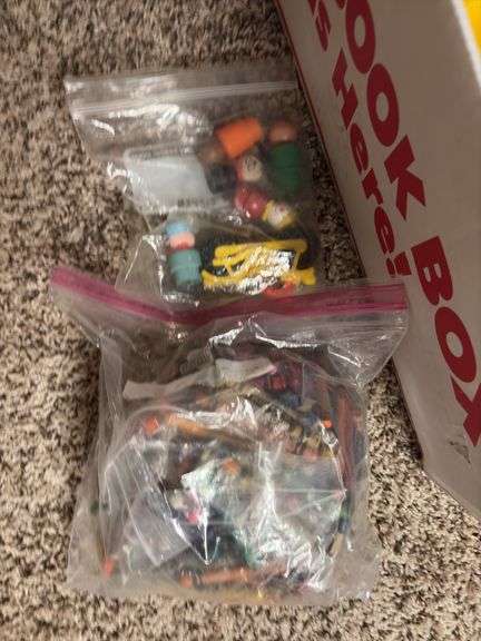 Box of assorted Fisher Price people and animals along with a bunch of other small toy items