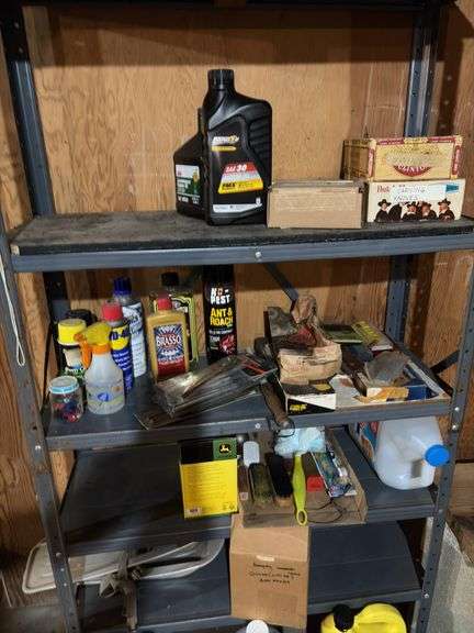 Contents of metal shelf and above stairs includes motor oil, deicers, washer fluid, extension cords, glues, etc