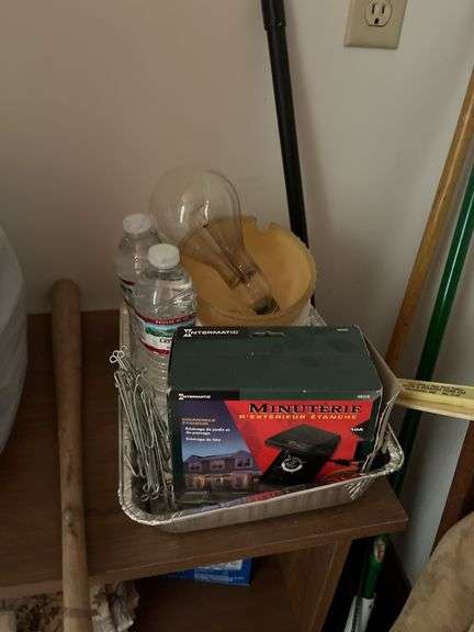 Small shelf with scale, cleaning stuff, battery charger, wooden ironing board, etc