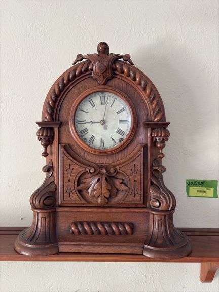 Antique walnut key wind shelf clock, very ornate carved case. Not sure if American or European ???