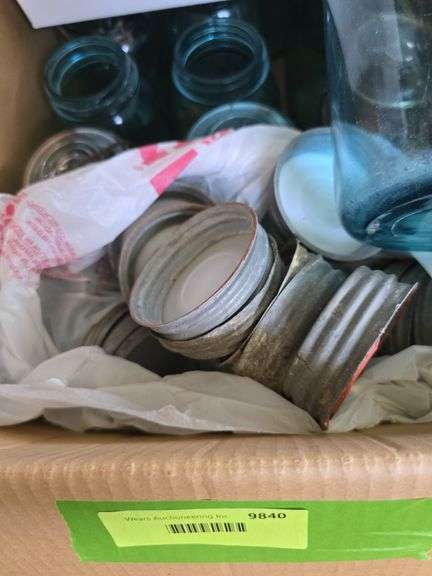 Box of blue canning jars of various sizes