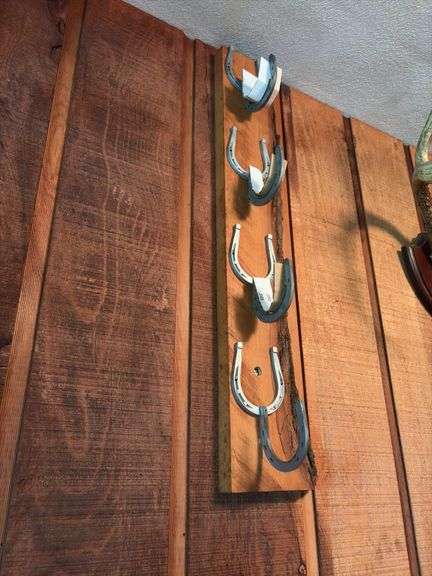 Raccoon hat, horseshoe gun rack