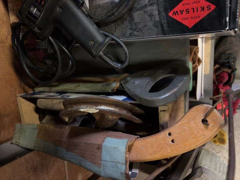 Shelf of various hand tools as shown