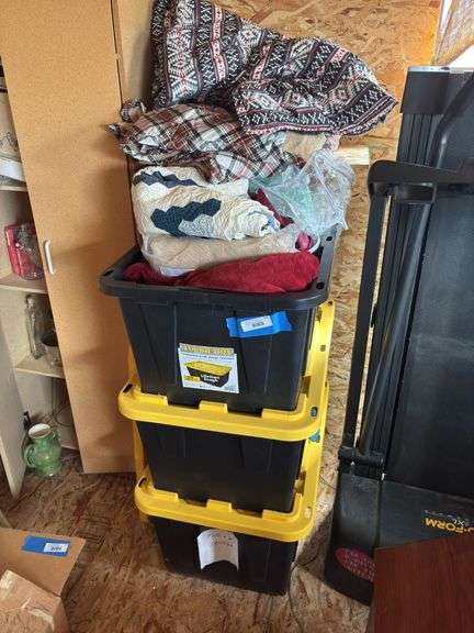 Three totes full of blankets