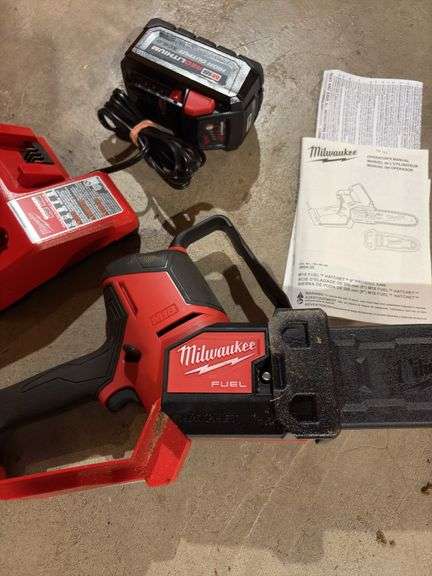 Milwaukee Fuel M18 pruning saw with battery and charger