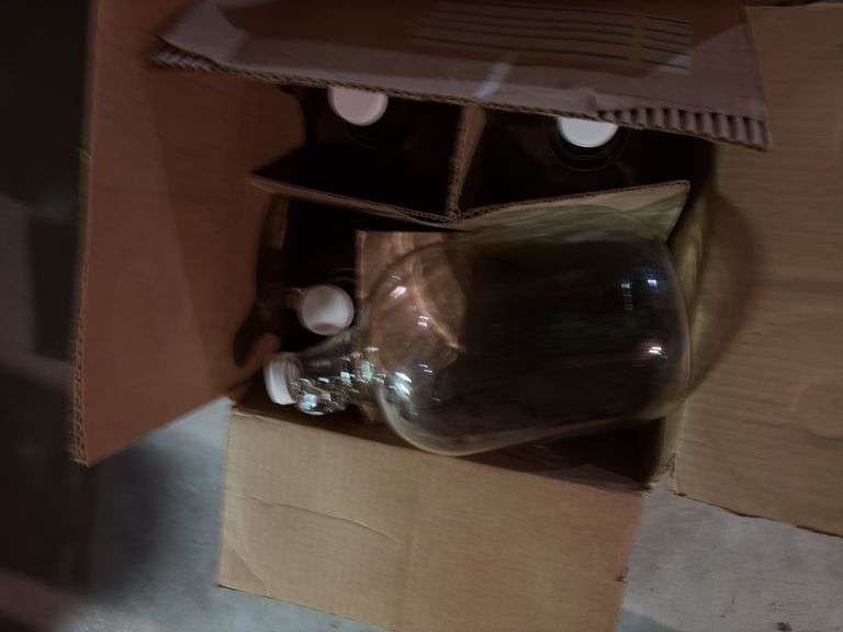 8 clear glass 1 gallon bottles, appear new