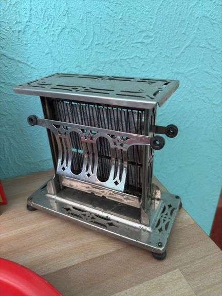 Vintage kitchen items includes Betty Crocker cookbook, serving trays, toaster and cake server