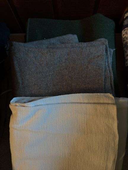 Two wool blankets and a sheet style blanket