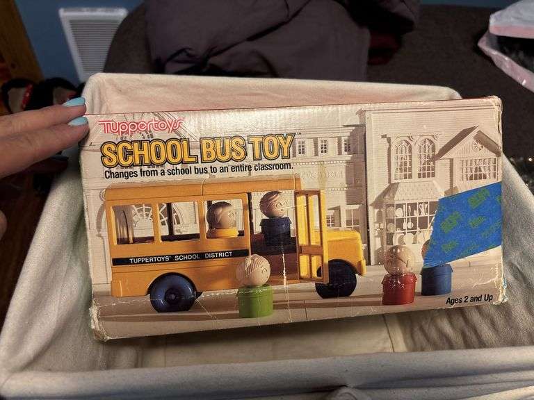 Three lined storage bins and school bus toy