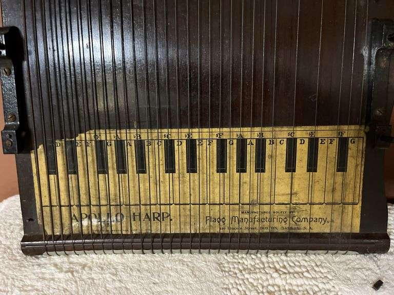 2 stringed musical instruments, Apollo Harp and another similar one
