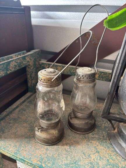 Two Dietz lanterns and two small skaters lanterns