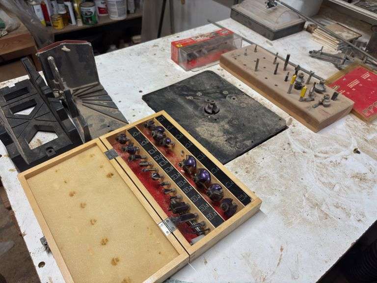 Large router table includes router and lots of router bits - try to come at the end - may need disassembled to remove