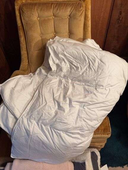 Two twin size down comforters, one does have a hole that needs repaired