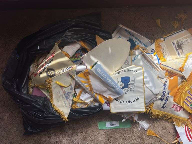 Large assortment of rotary club flags from all over the world! These have been in a smoking home