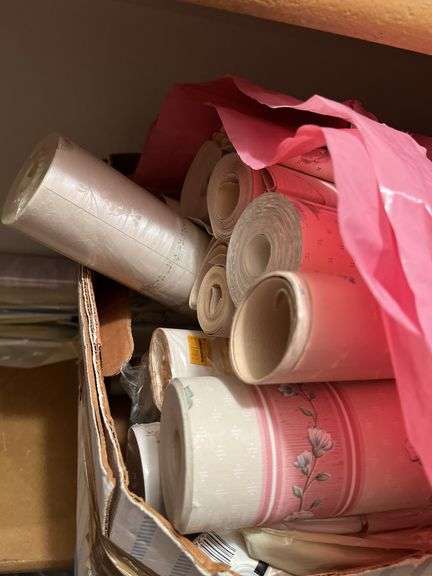 New curtain rods and box of wallpaper, some new