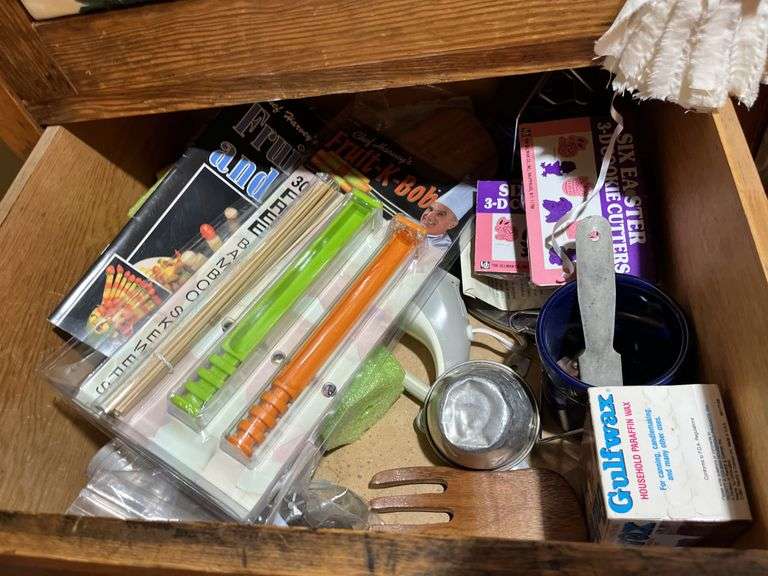 Contents of wardrobe includes 4th of July decor and many vintage kitchen utensils