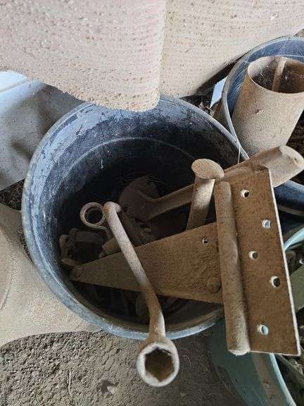 4 buckets and a box of farm iron