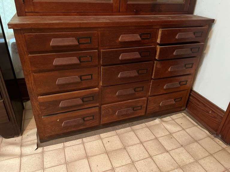 26D x 56L x 90H two piece kitchen cupboard with glass front doors on top and 15 drawers on bottom May need tools to take apart
