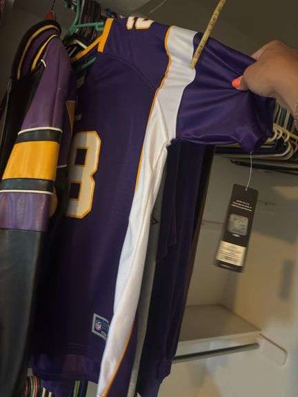 Large assortment of Minnesota Vikings clothing, some still with tags - these all have been in a smoking home