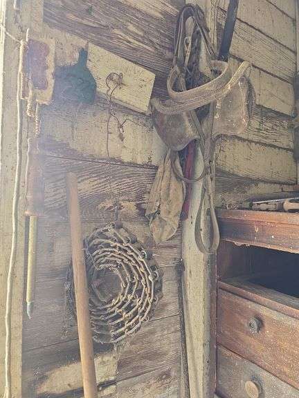 Contents of tool shed includes tool boxes, 2 floor jacks, 2 man saw, windows, buckets of charcoal, nail kegs, nails, pony shoes and more See photos, bring your gloves!