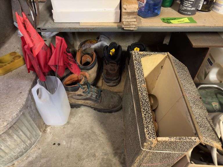 Bottom two shelves includes starting fluid, insect repellents, shoes, gloves, etc