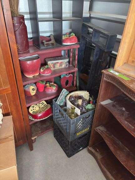 Two shelving units and lots of smaller shelves and storage items plus group of apple kitchen items