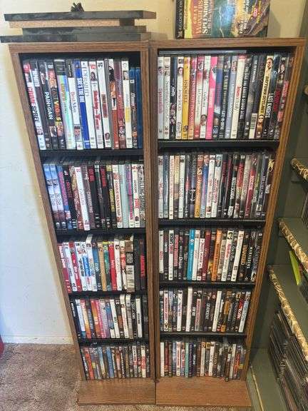 Two shelves full of DVDs and CDs