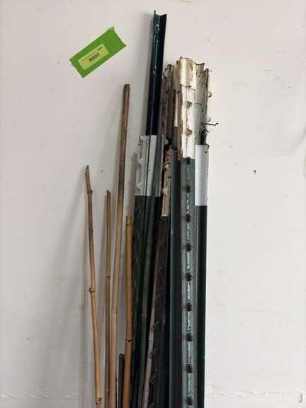 12 T-posts and bamboo garden stakes